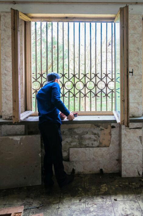 2015 - Izidor looking out his old window at orphanage