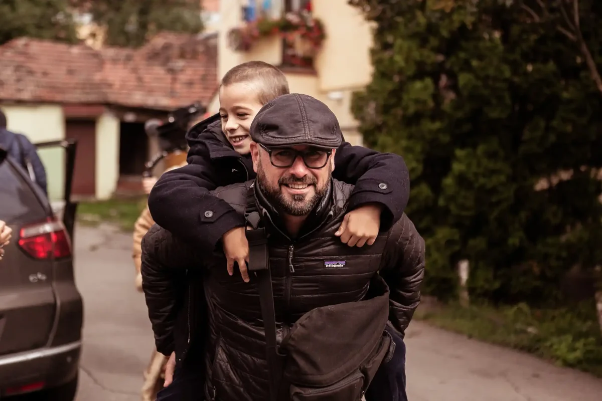 Young Izidor and Director having fun on set